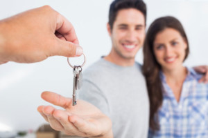 couple accepting keys home buying